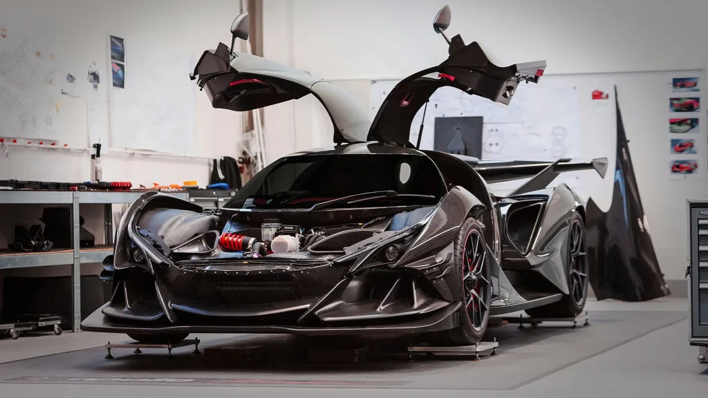 Apollo IE under construction with butterfly doors open at Manifattura Automobili Torino