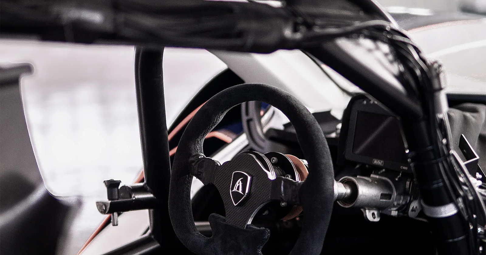 Aspark SP600 – cabin close-up with steering wheel