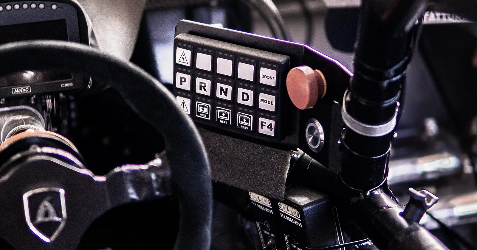 Aspark SP600 – close-up of steering wheel and driver controls