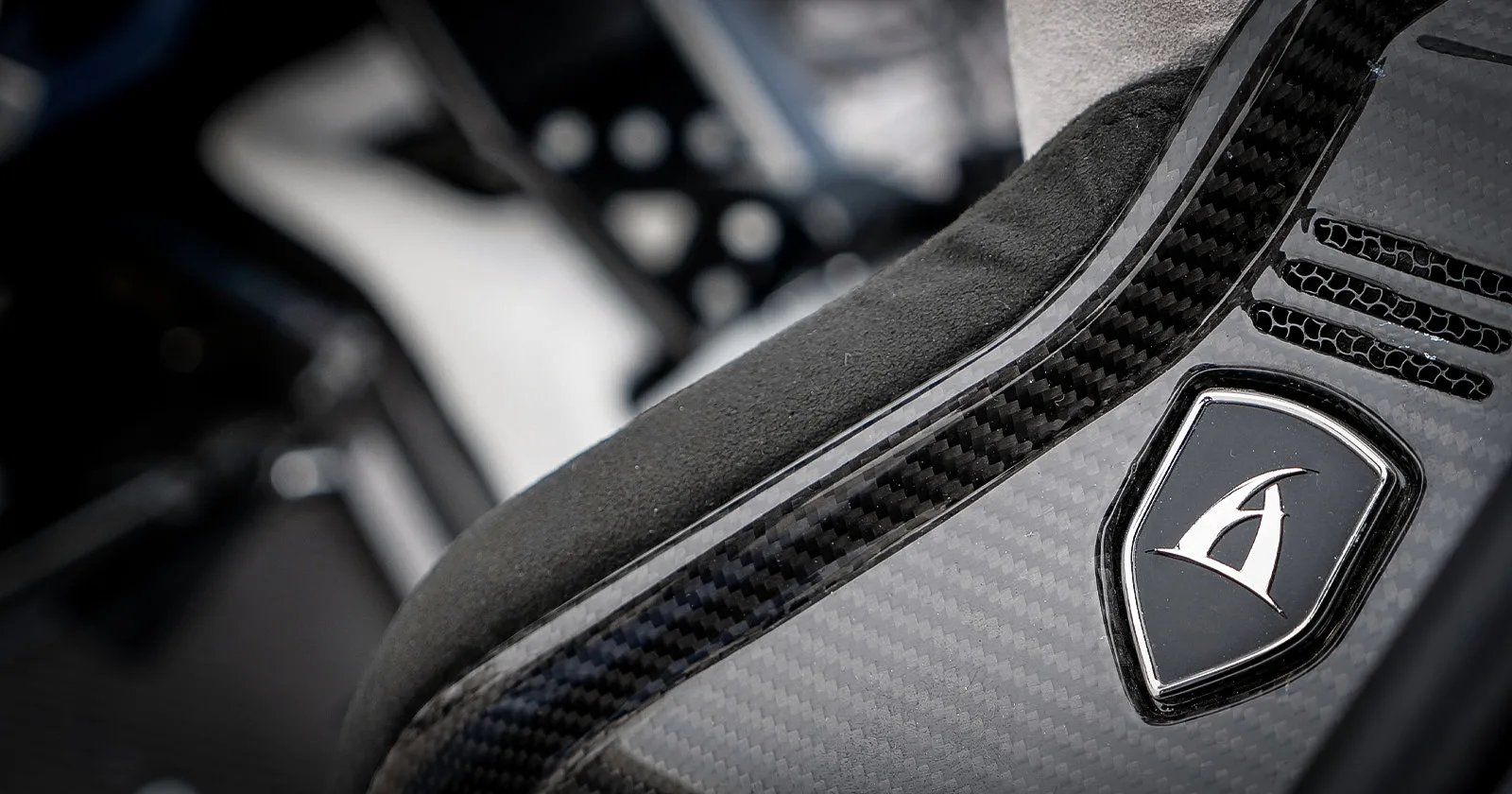 Aspark Owl – metallic logo detail