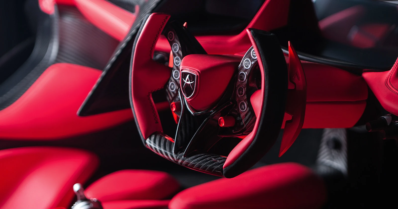 Apollo IE – red leather steering wheel and interior detail