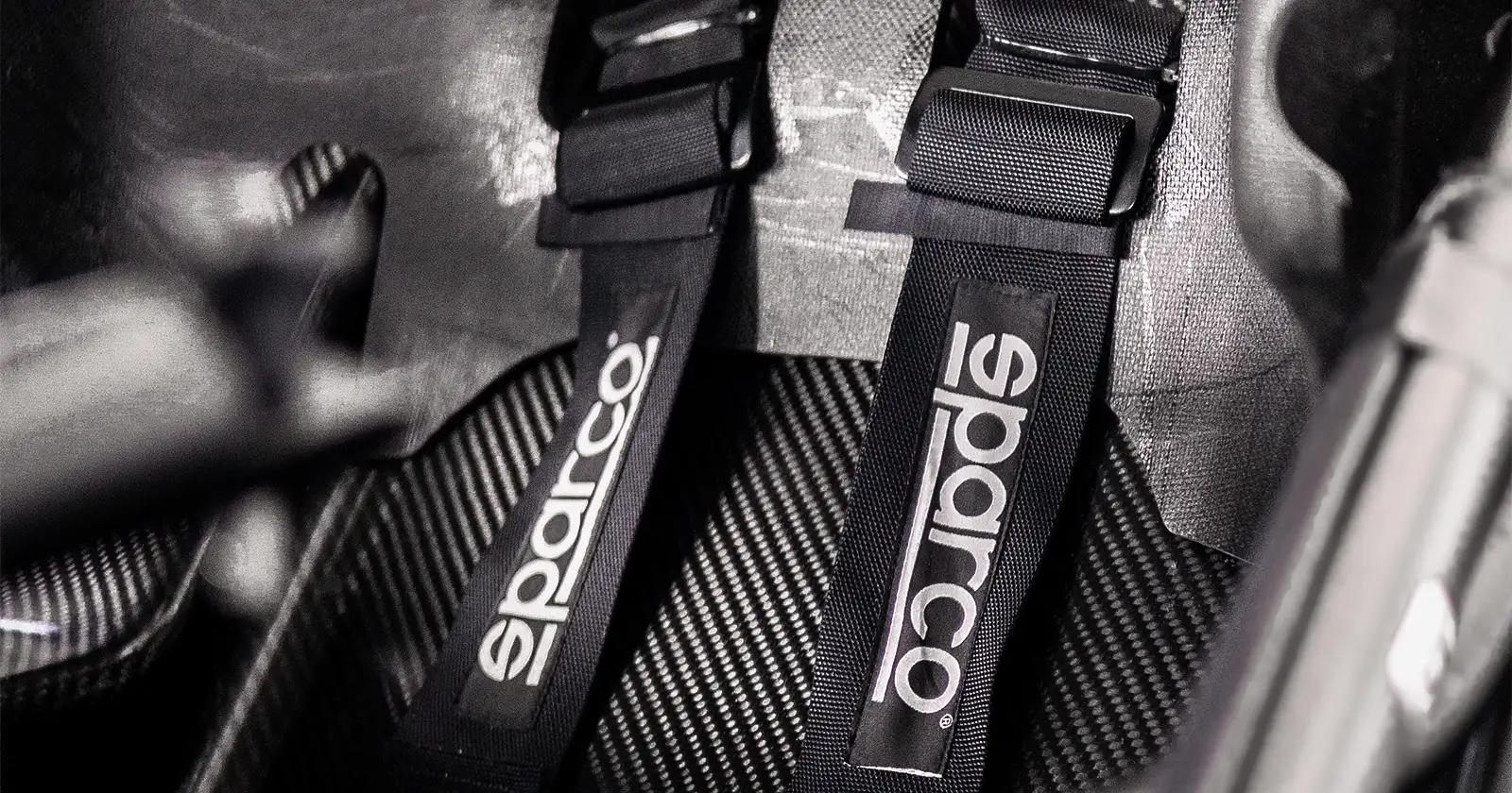 Aspark SP600 – Interior Detail with Metal M.A.T. Logo and Sparco Harnesses | Fastest Electric Car in the World