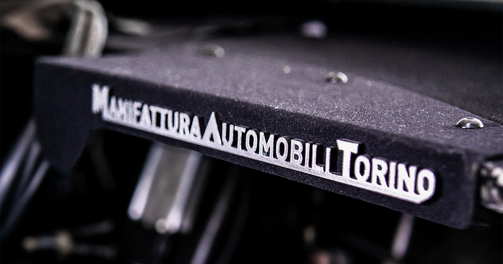 Aspark SP600 – metal M.A.T. logo interior detail